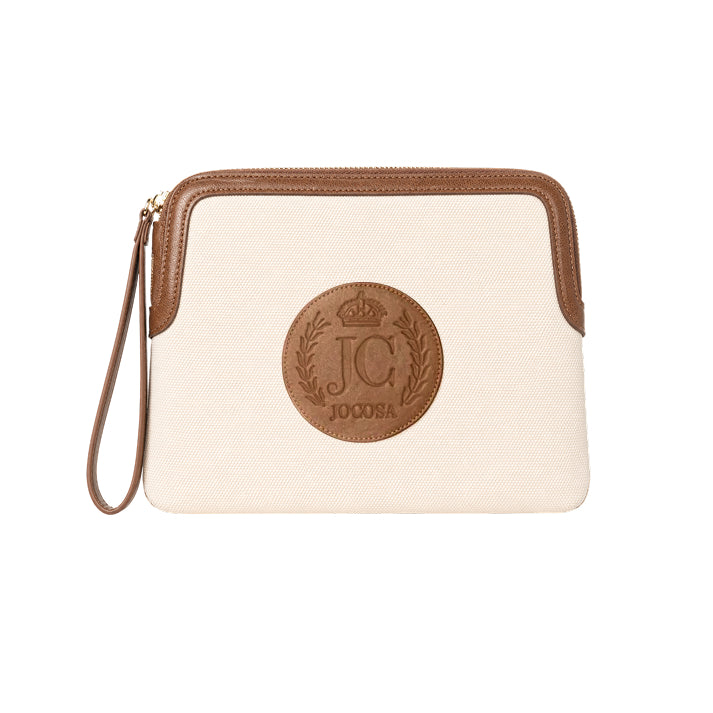 JOCOSA Locker Pouch in ivory canvas with camel leather trim, gold-tone zipper, matching leather wrist strap and embossed leather logo.